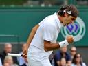 Federer scrapes through