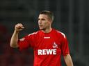 Podolski pen lifts Cologne