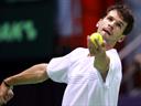 Karlovic's booming serve knocks out Dimitrov