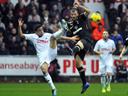 Swansea halt Spurs charge
