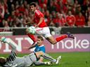 Benfica ease through