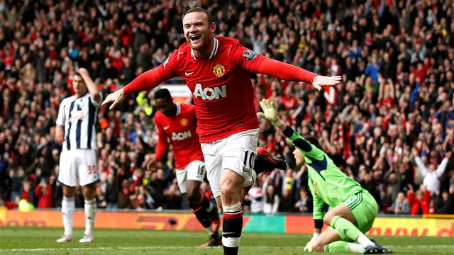 Rooney brace sends Man United top
