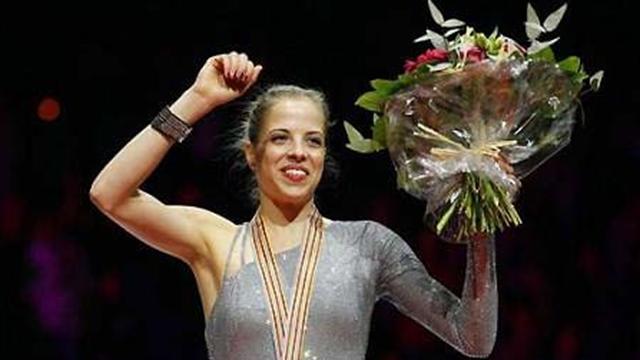 Kostner wins world title at ninth attempt