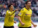Dortmund win to stay top
