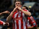 Stoke hold off late Reading charge for victory