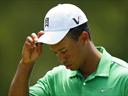 Woods misses cut