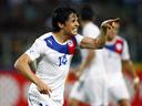 Chile go top with late win