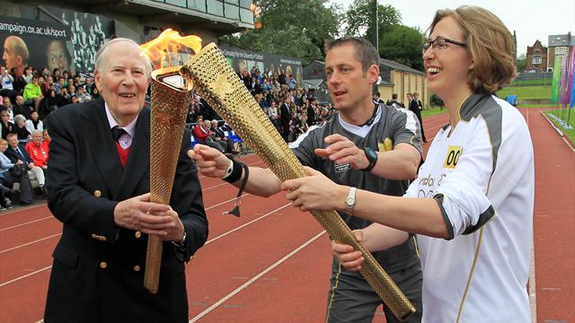 Bannister carries torch at site of famous mile