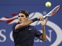 Federer eases through