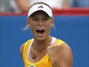 Wozniacki through in Seoul