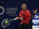 Djokovic through in China 
