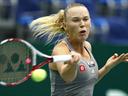 Wozniacki, Stosur through in Moscow