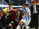 Flying Malaga overcome struggling Milan
