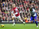 Arsenal scrape win as Wilshere returns