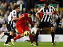 Suarez stunner secures point for Liverpool