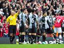 Arsenal thump 10-man Spurs after Adebayor sees red