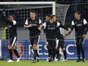 Malaga win group with draw at Zenit 