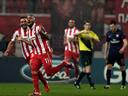 Olympiacos deny Arsenal top spot