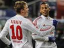 Rudnevs fires Hamburg into sixth amid protests