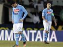 Napoli docked two points, fined over betting scandal