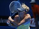 Sharapova through without dropping game