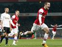 Wilshere strikes late as Arsenal see off Swansea