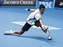 Djokovic fights through, Tipsarevic wins epic