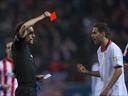 Three red cards and three penalties as Atletico win 