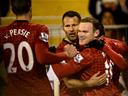 Rooney steers United past Fulham