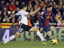 Valencia hold Barcelona despite Messi goal