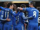 Late strikes ease Chelsea past Wigan