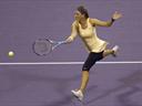 Azarenka, Serena reach Qatar last eight