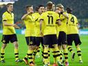 Reus treble gives Dortmund win