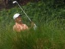 Woods gets wet, trails Honda leader Villegas by six shots 