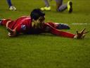 Suarez bags three in rout of Wigan