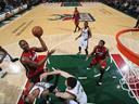 Heat win 21st straight game 