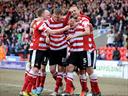 Doncaster remain top, Cherries chase