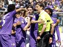 Ten-man Fiorentina fight back against Milan