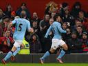 Aguero stunner seals derby win for City