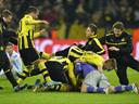 Dortmund score two in injury time to knock out Malaga