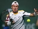Hewitt upset in Houston before rain stops play