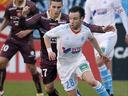 Marseille rely on strong defence in home straight