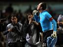 Keeper penalty helps plot Sao Paulo path to last 16