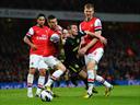 Arsenal condemn Wigan to relegation