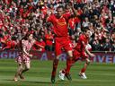 Liverpool win in Carragher's swansong