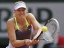 Sharapova through after scare, Azarenka battles back to beat Cornet