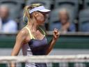 Sharapova overcomes Jankovic