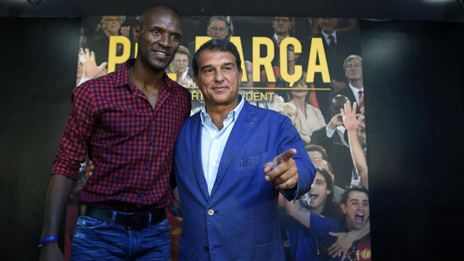 Candidate for presidency of FC Barcelona, Joan Laporta (R) poses with former FC Barcelona's player Eric Abidal during a press conference on his plans for the football team, in Barcelona on June 22, 2015