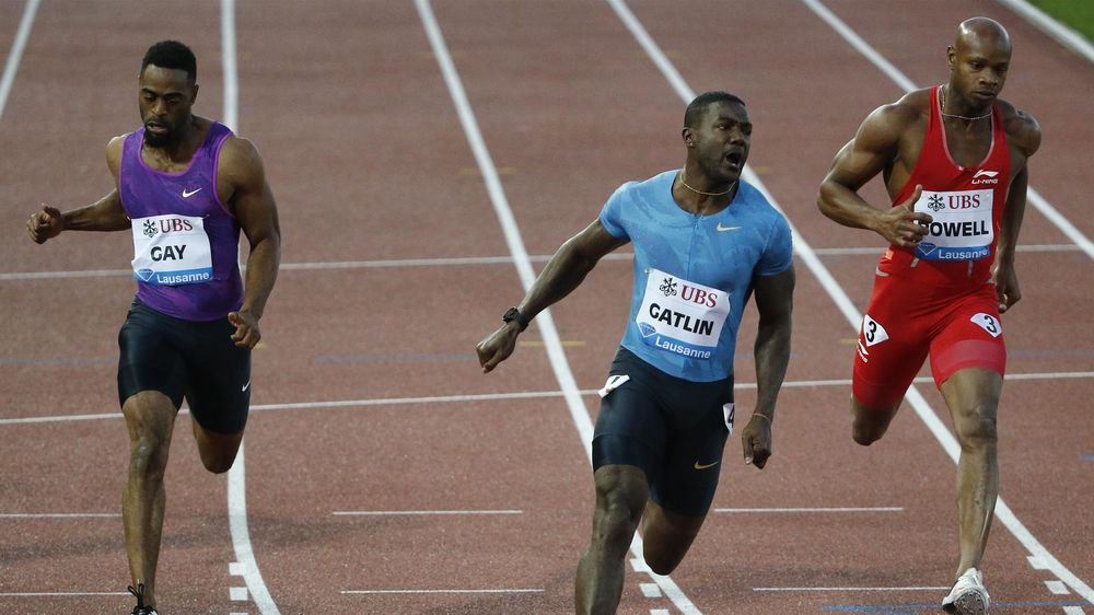 Tyson Gay of the U.S., Justin Gatlin of the U.S. and Asafa Powell of Jamaica compete in the 100 meters men event at the IAAF Diamond League Athletissima athletics meeting at the Pontaise Stadium in Lausanne, Switzerland, July 9, 2015