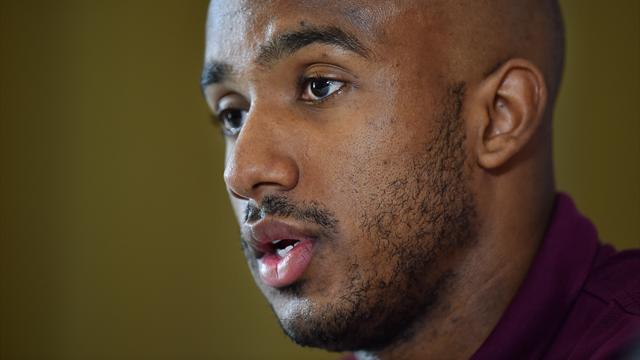 England midfielder Fabian Delph speaks during a press conference following a team training session at London Colney, north of London, on June 11, 2015